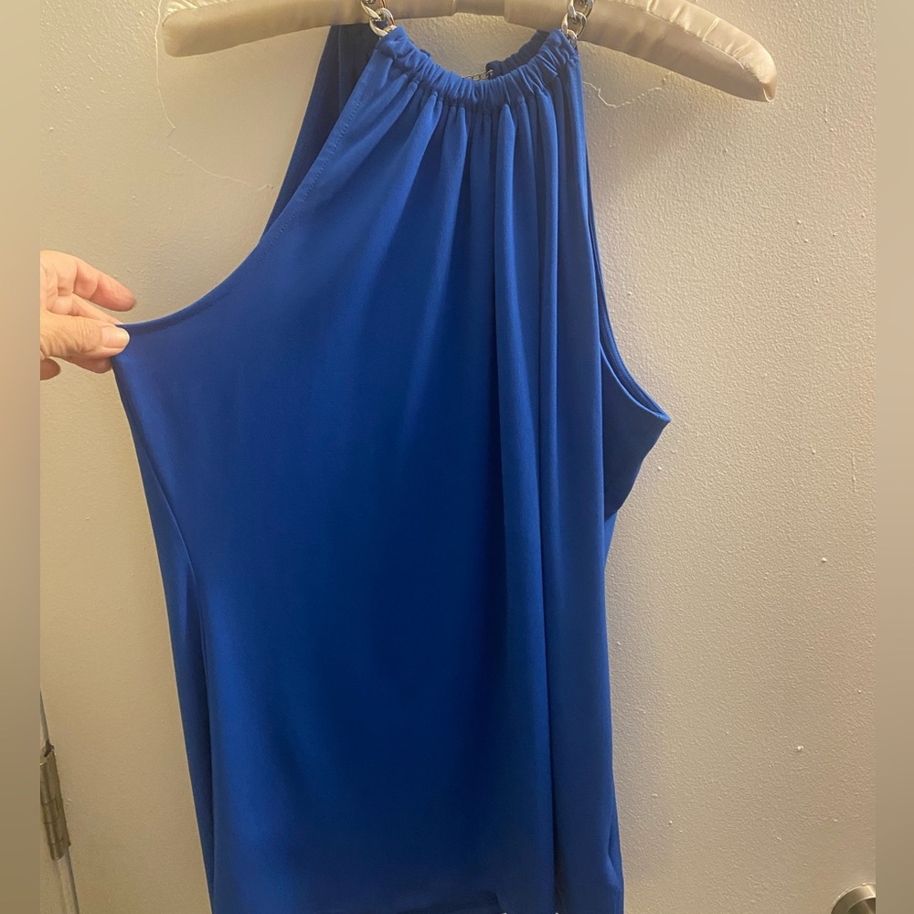 Blue is Michael Kors size L no tags, Green is Calvin Klein size L Price is both